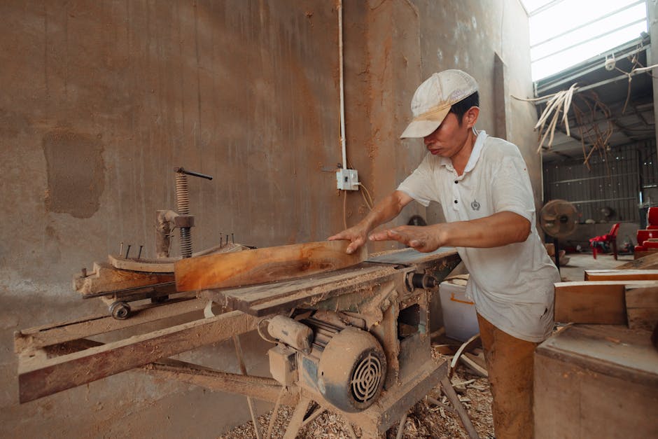 Master carpenter working meticulously in a woodworking workshop